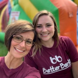 Two Better Banks employees outside at a bank event having fun